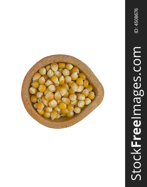 Corn in the plate isolated over white