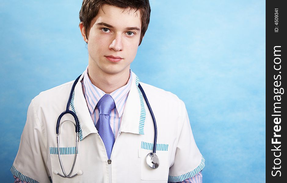 Young handsome caucasian doctor with stethoscope
