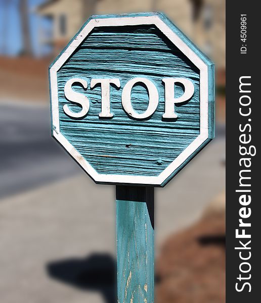 Blue stop sign on blurred background