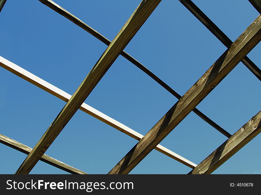 Roof Beams exposed with blue sky background. Roof Beams exposed with blue sky background