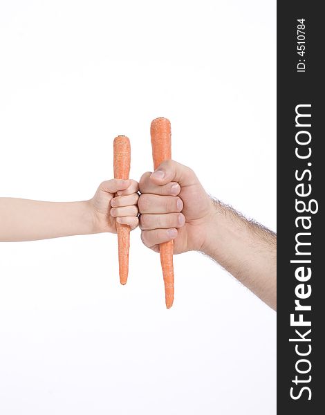 Father and son take a carrot