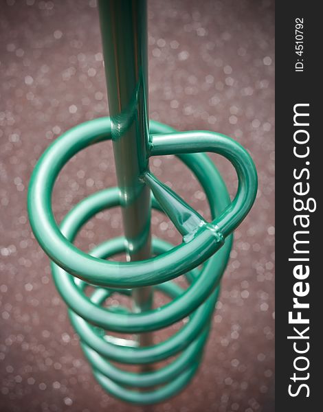 Teal green spiral climber at playground, great bokeh and depth of field