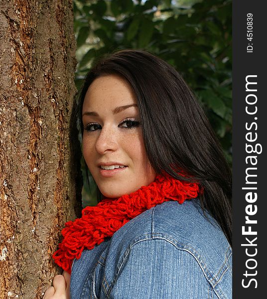 Girl Leaningagainst Tree Wearing Red Scarf
