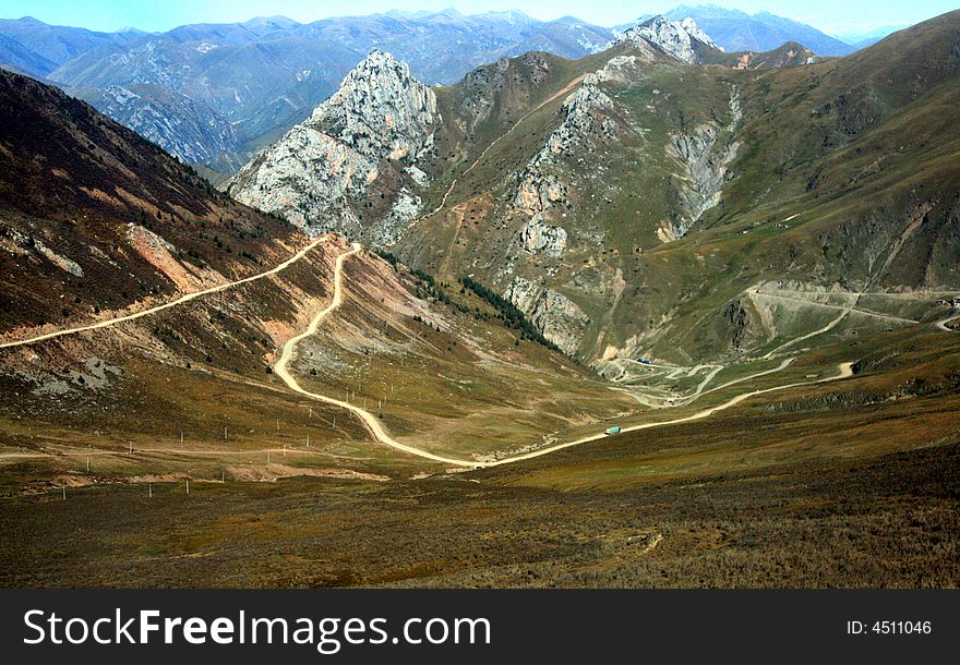High altitude mountain road bend, at tibet china. High altitude mountain road bend, at tibet china