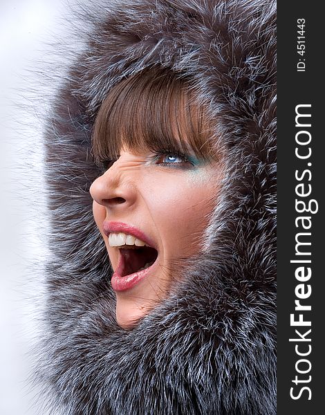 Beautiful, Shouting Young Woman With A Fur Hood