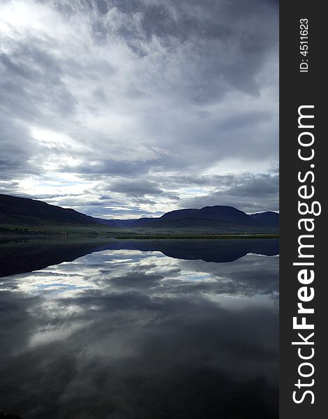 Dramatic Icelandic lake with reflection