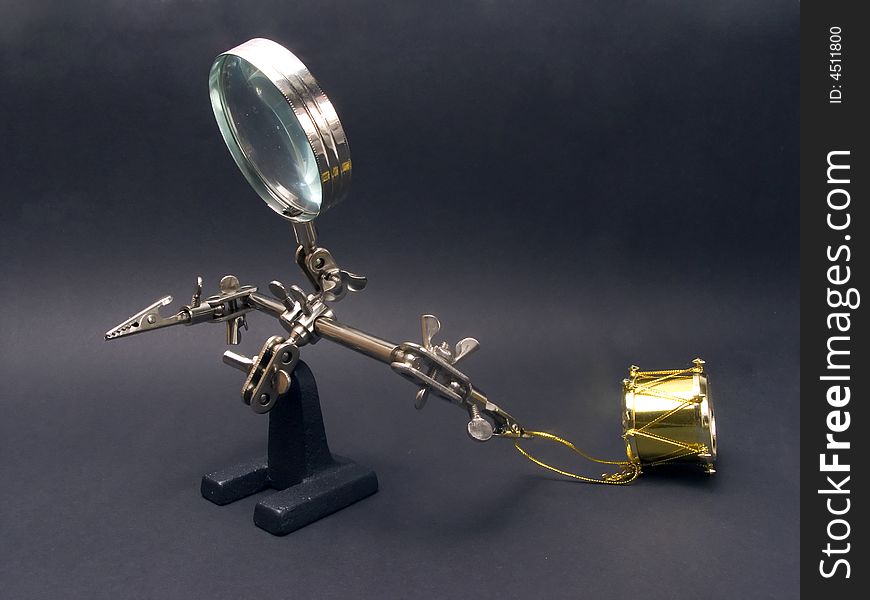 Magnifying glass man with drum. Magnifying glass man with drum