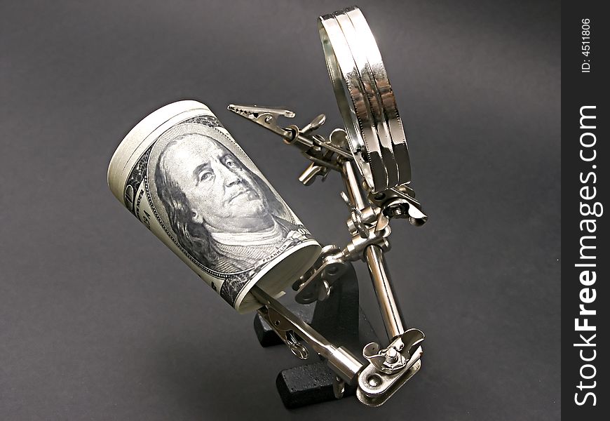 Magnifying glass man examining dollar bill. Magnifying glass man examining dollar bill