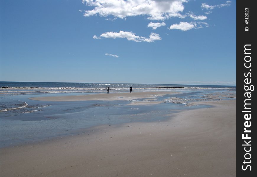 Wild beach, water, the sea, the dark blue sky, blue water