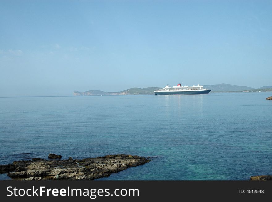 Queen Mary 2, largest cruise ship in the world in port of Alghero - Sardinia - Italy