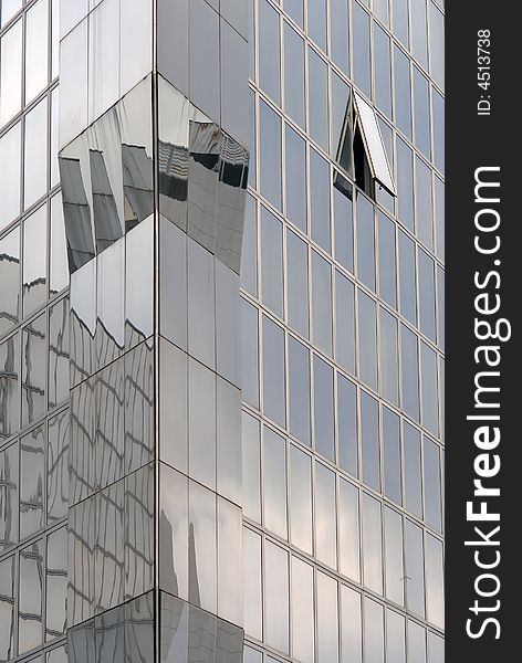 Modern skyscraper window reflections, vertical view