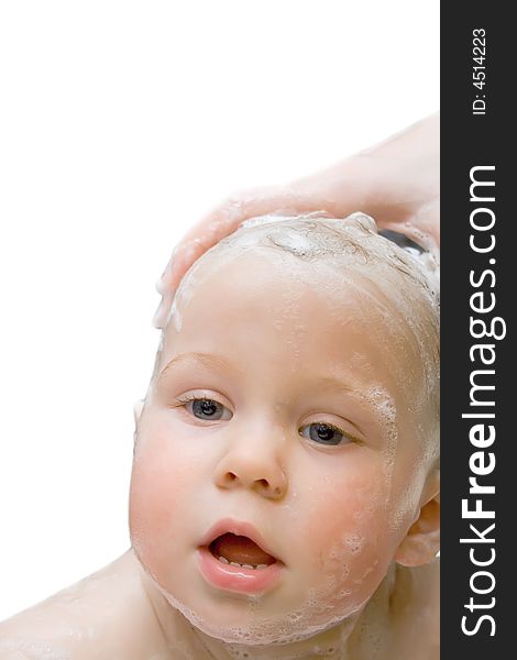 Bathing baby on isolated background looking at camera