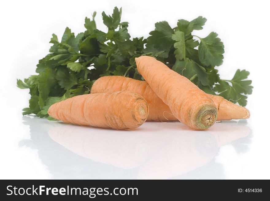 Parsley and carrots isolated on white background