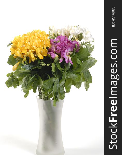 Different color  flowers and leaf in glass vase. Different color  flowers and leaf in glass vase