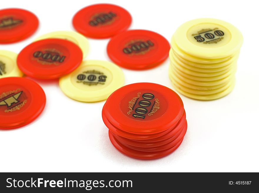 Red and yellow  casino chips isolated on white