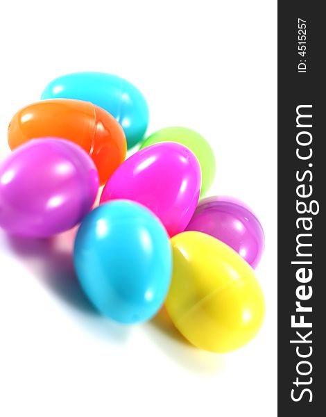 A crowd of pastel Easter eggs on white background