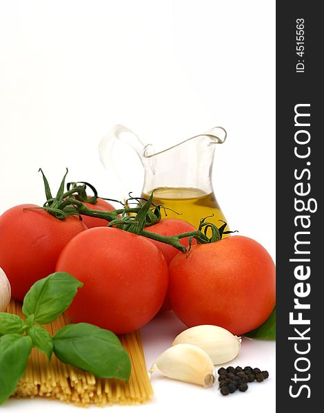 Spaghetti preparation: tomatoes, olive oil, garlic and basil