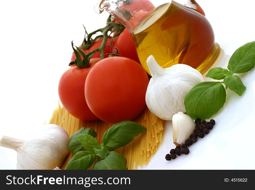 Spaghetti preparation: tomatoes, olive oil, garlic and basil