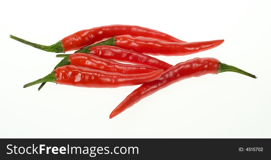 Fresh fresh red chili peppers isolated on a white background