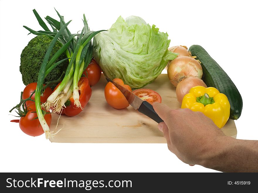 Kooking image of a cutting board, knife and vegetables. Kooking image of a cutting board, knife and vegetables