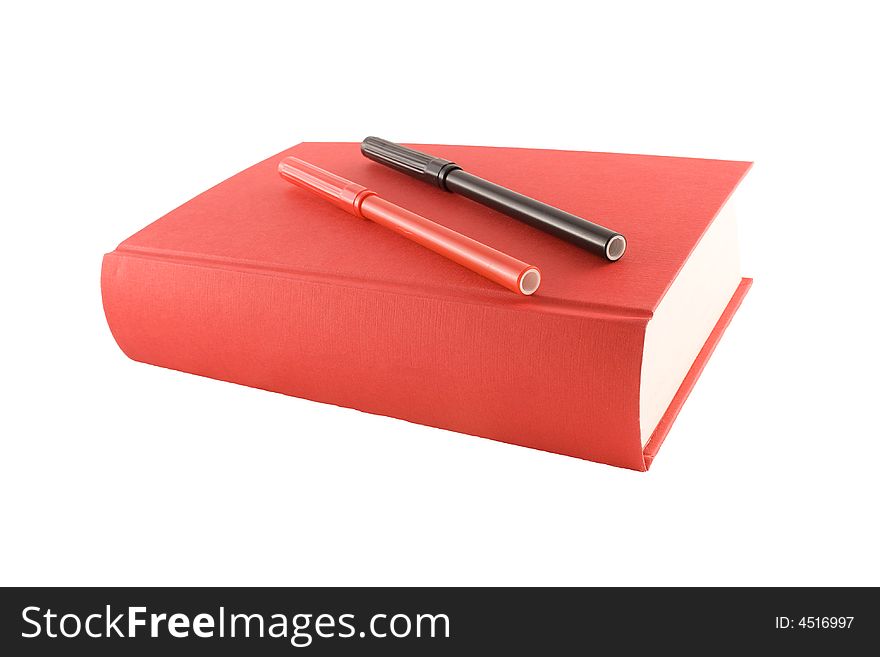 Red book and markers isolated on a white background