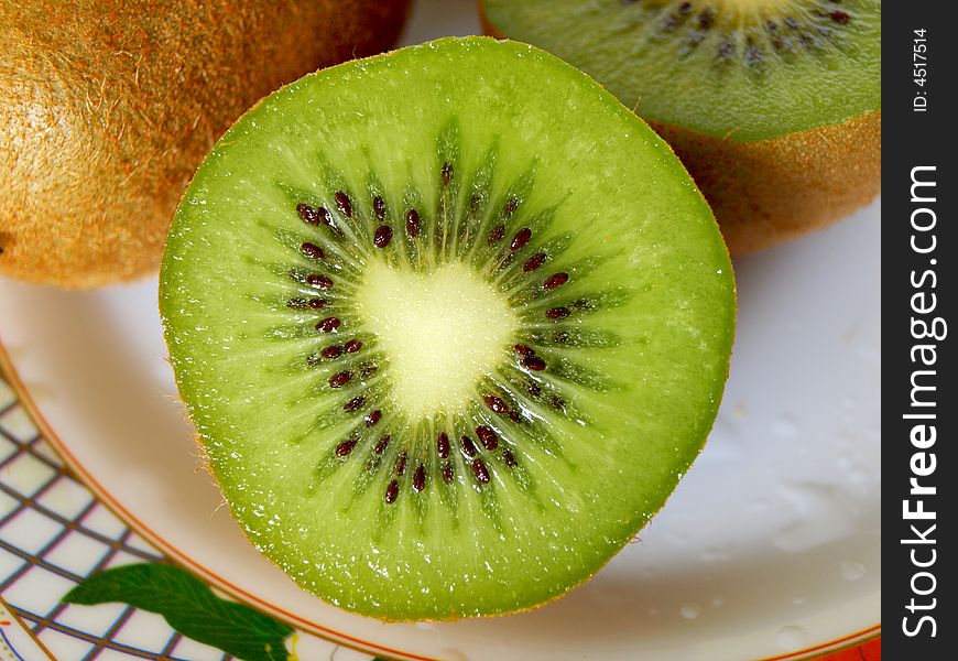 Photo of sliced kiwi fruit on a plate. Photo of sliced kiwi fruit on a plate