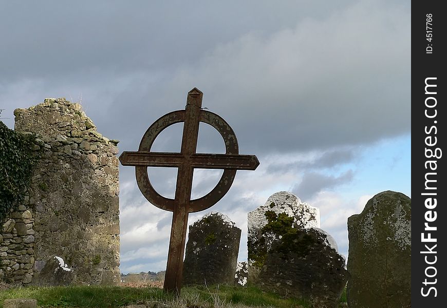 An old cemetery in Ireland with a celtic cross