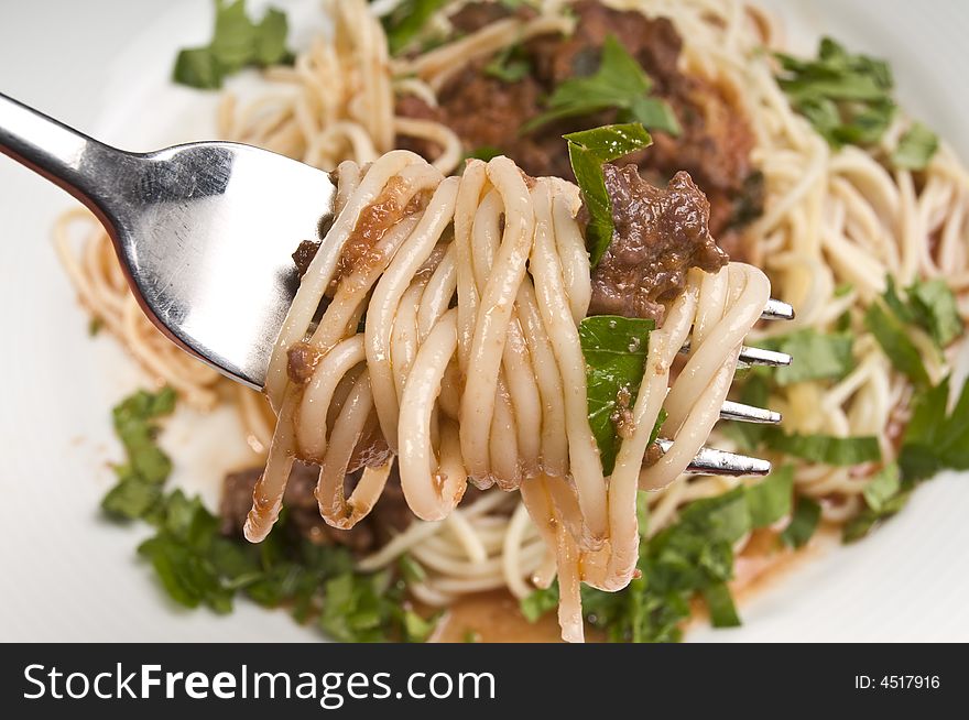 Spagheti bolognese with fork close-up