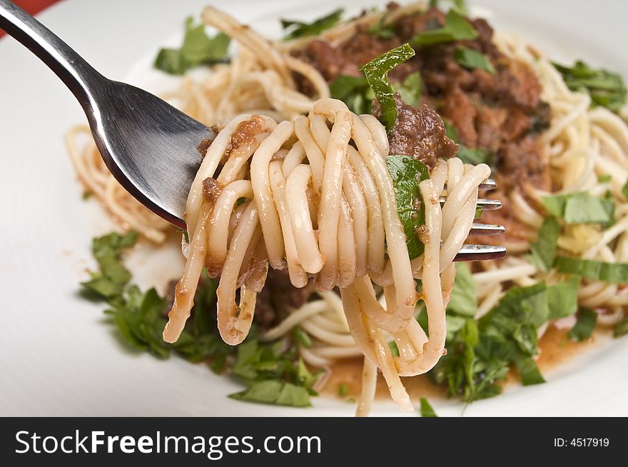 Spagheti bolognese with fork close-up