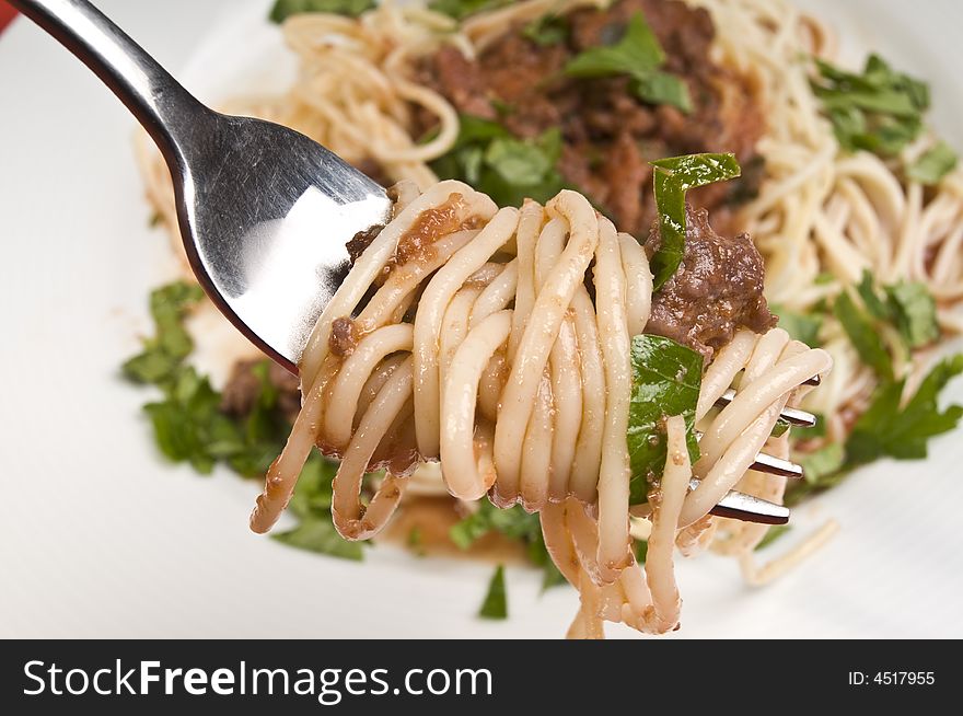 Spagheti bolognese with fork close-up