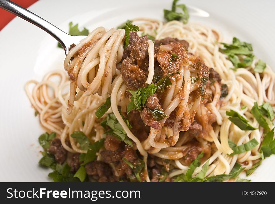 Spagheti bolognese with fork close-up