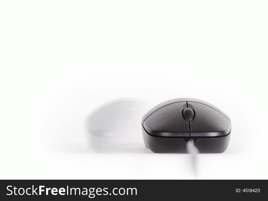 A Black Computer Mouse In Motion