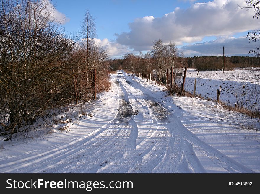 Snow rural road to winter serene day. Snow rural road to winter serene day