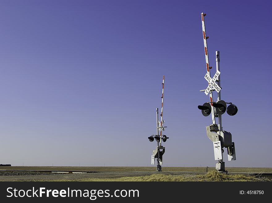 Railroad Crossing With Two Guards Standing Ready