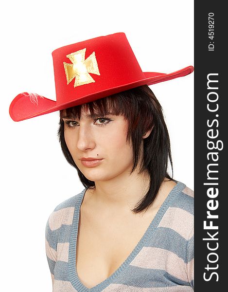 Portrait of the young woman in a red hat