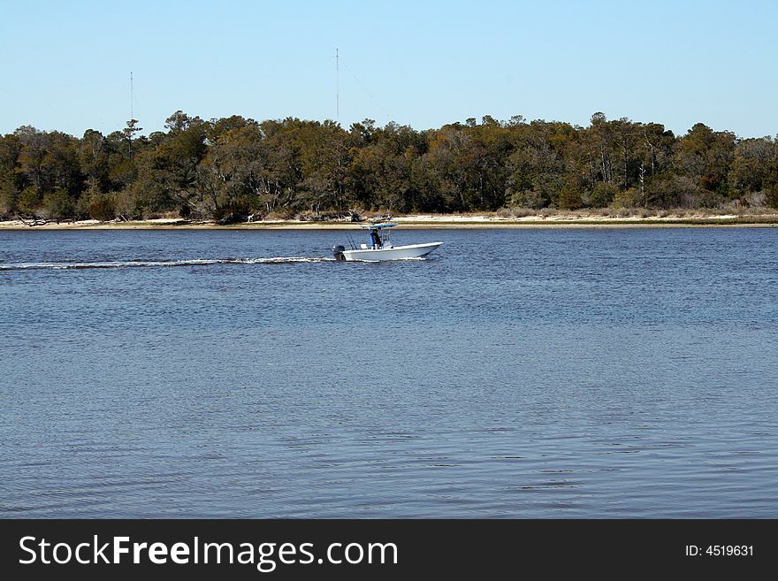 A passing power boat on the waterway. Would make a great background.