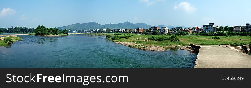 A broken bridge in the river by a town, Guilin City, Guangxi, China. A broken bridge in the river by a town, Guilin City, Guangxi, China