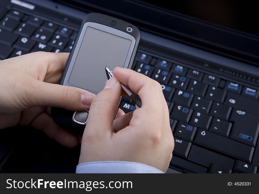 Businesswoman holding modern mobile pda phone