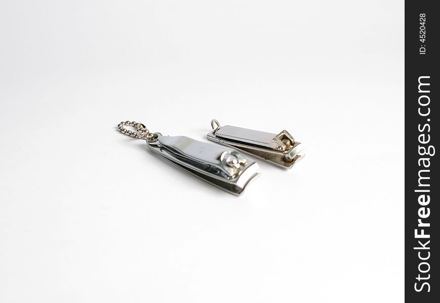 Two silver nail cutters on white background. Two silver nail cutters on white background