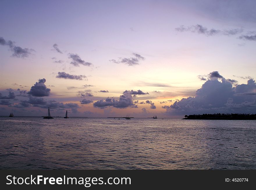 Peaceful dust by the sea with sailboats