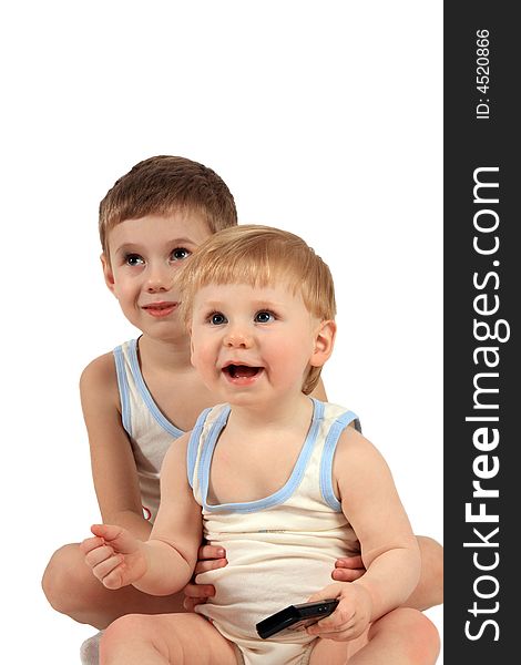 Two boys in identical clothes look in the chamber