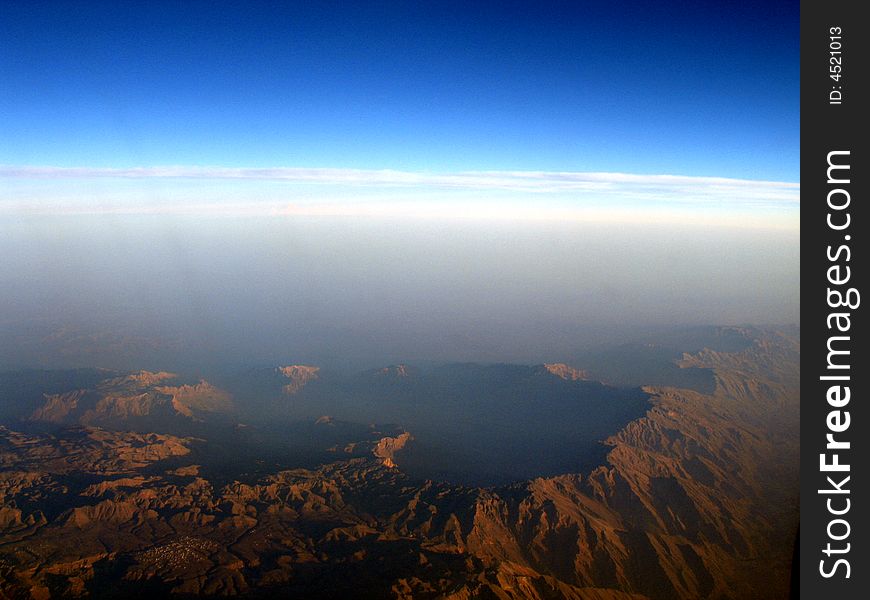 Sultanate of oman mountain peak view from 40000feet above the sea level. Sultanate of oman mountain peak view from 40000feet above the sea level.