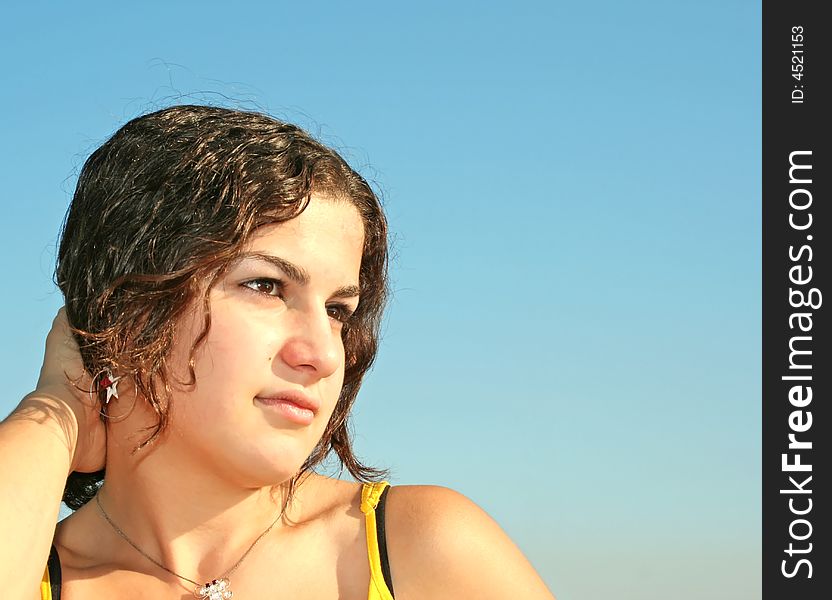 Beautiful young girl with earrings and necklace. Beautiful young girl with earrings and necklace.