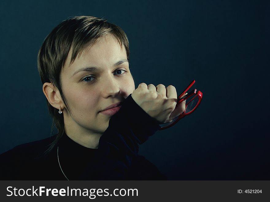 Portrait of a young pretty woman with the red glasses. Portrait of a young pretty woman with the red glasses