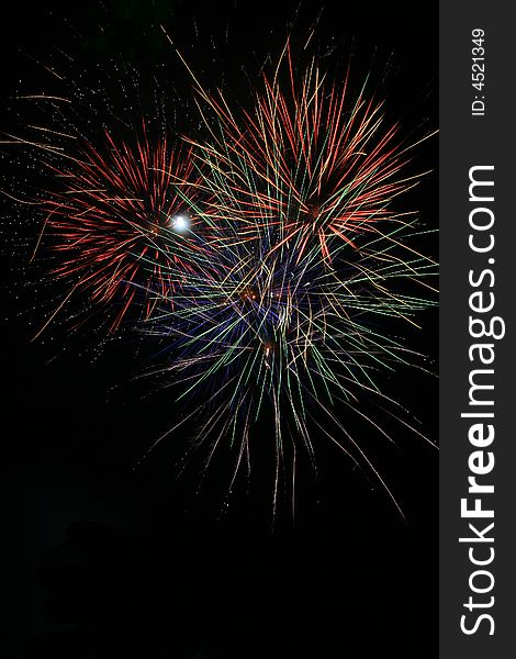 Bright colorful fireworks isolated against a black sky. Bright colorful fireworks isolated against a black sky