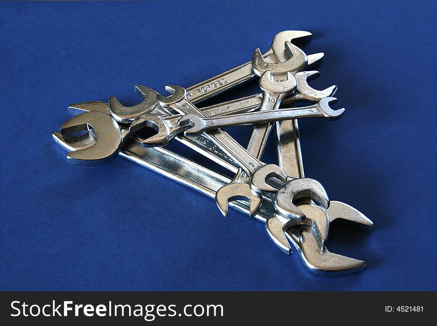 Steel triangle made by wrenches of different sides. Steel triangle made by wrenches of different sides