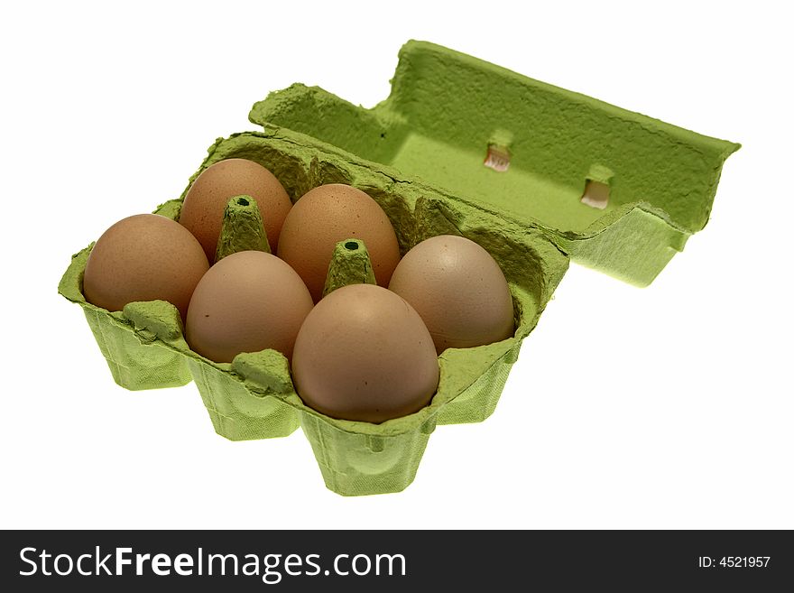 Eggs in an egg carton over white.