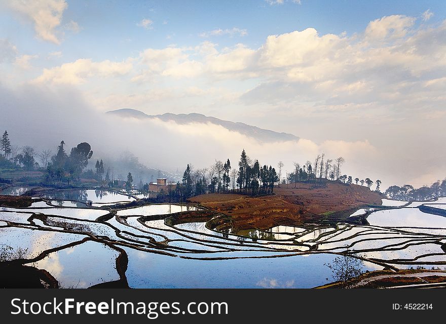 The village is encircled by the terrace and the clouds. The village is encircled by the terrace and the clouds