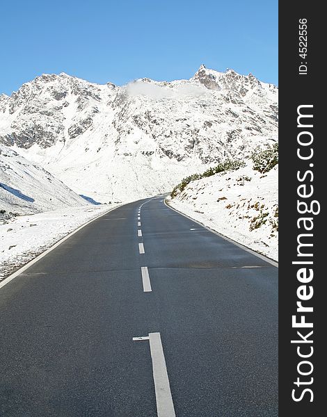 Beautiful winter panorama in the alps with an empty street. Beautiful winter panorama in the alps with an empty street