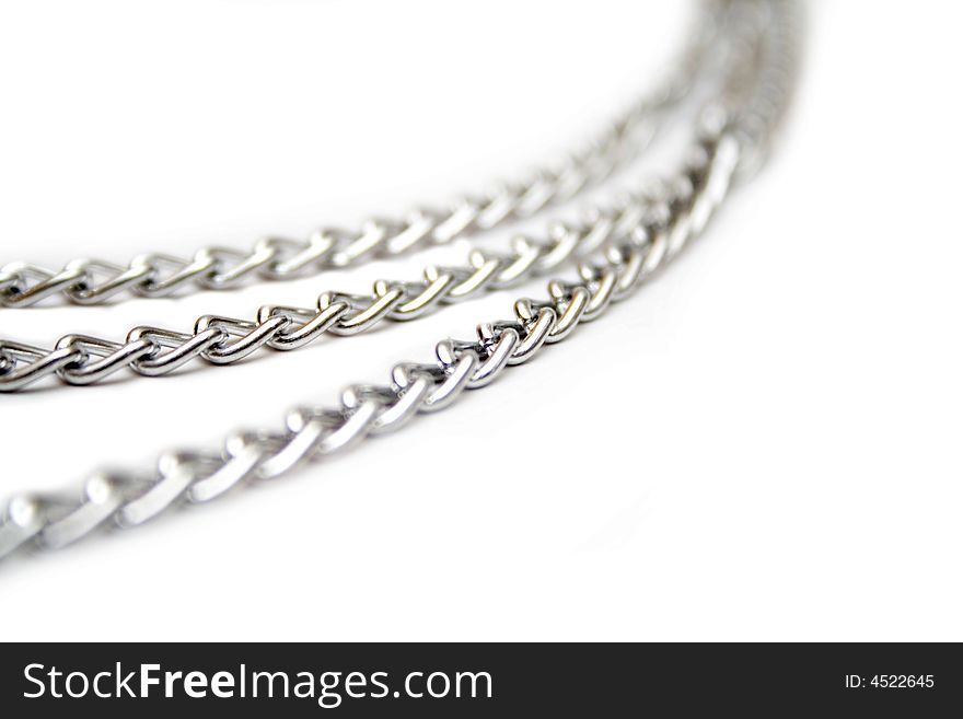 Fragment of silver chain on the white isolated background